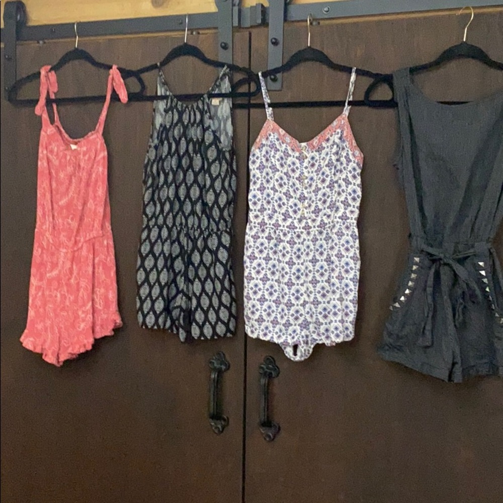 Set of 4 rompers. 2 S and 2 XS